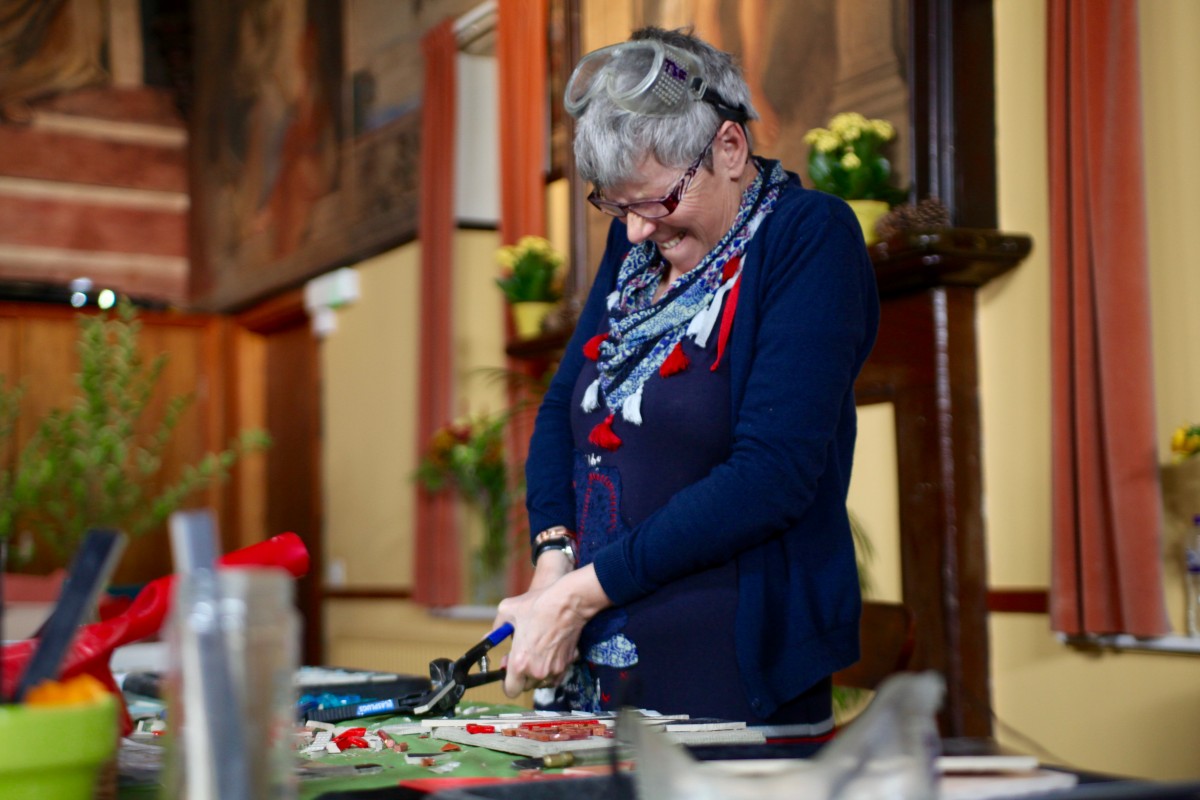 Cheryl Stewart summoning the strength to cut tiles!